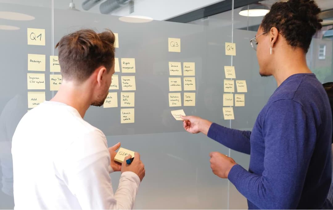 Office workers discussing software project